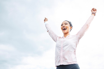 Image showing Excited, fitness success and winning woman with power sign, exercise celebration and clouds sky mock up for advertising. Happy, energy and wellness sports runner person with workout goal achievement