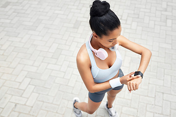 Image showing Exercise, runner and black woman with digital smartwatch to track steps, calories counter or heart rate. Sports health, running monitor and fitness app to check wellness, training and workout support