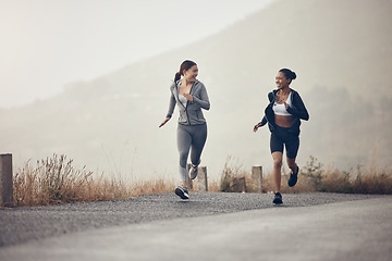 Image showing Running, fitness and exercise with a woman friends in sport on a road or street for cardio training in the morning. Workout, health and endurance with a female runner and friend in the mountains