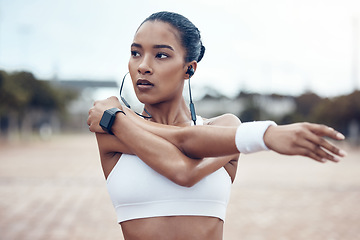 Image showing Black woman, fitness and stretching, exercise and earphones, music and motivation for active lifestyle outdoors. African American, strong and focus, cardio and endurance, workout and healthy living.