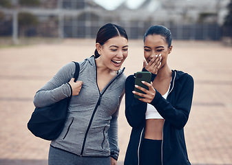 Image showing Happy, phone and friends laughing at a funny online joke after a workout in a city together, cheerful, humour and carefree. Social media, internet and women sharing comedy meme or internet post