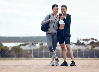 Image showing Women, phone or fitness selfie after training, workout or exercise in Colombian stadium. Smile, happy or sports runners or friends on mobile 5g technology for health data analysis or wellness success