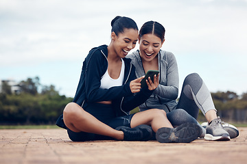 Image showing Phone, happy and fitness friends on social media laughing at funny gossip, fake news and trending viral online content. Women, sports and healthy girls resting for training workout exercise outdoors