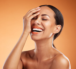 Image showing Skincare, beauty and woman with smile for makeup against an orange mockup studio background. Face of a happy, young and clean girl model in happiness for dermatology, cosmetics and facial wellness