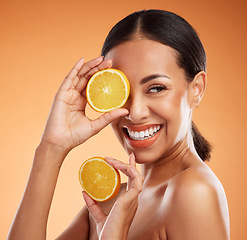 Image showing Skincare, makeup and beauty girl with orange product for diy facial treatment, cosmetics or self care. Natural detox, fruit and happy black woman face with smile, glowing skin and body care nutrition