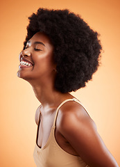 Image showing Happy black woman, cosmetic beauty and natural skincare or haircare wellness. African girl skin health, afro fun hair and healthy happiness glow lifestyle in studio against orange background