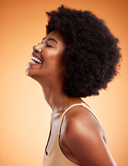 Image showing Cosmetics, black woman and smile with natural beauty with brown studio background being confident, happy and with afro. Makeup, female and African American girl being proud, laugh and clear skincare.