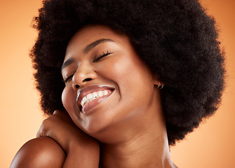 Image showing Black woman, skincare and natural beauty, face and skin, cosmetics advertising and orange studio background. Young African, fresh and glow, facial and body care treatment, happy cosmetology headshot.