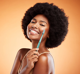 Image showing Black woman and portrait with toothbrush for dental wellness and teeth whitening in orange studio background. Afro, healthy and happy lady with oral hygiene, mouth cleaning or white smile face mockup