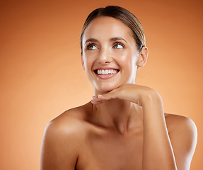 Image showing Face, beauty and skincare with a model woman thinking about cosmetics in studio on an orange background. Natural, skin and care with an attractive young female posing with her hand on her chin