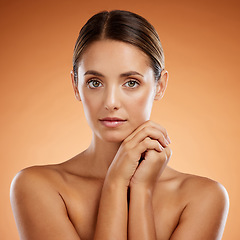 Image showing Beauty, skincare and portrait of woman with a cosmetic makeup or natural facial routine in a studio. Health, wellness and model from Mexico with a clean, fresh and beautiful face by brown background.