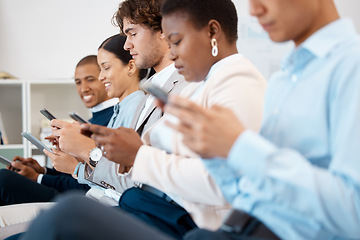 Image showing Phone, conference and team in a row in the office sitting in a convention, seminar or tradeshow. Diversity, technology and group of business people networking on smartphone at a corporate workshop.