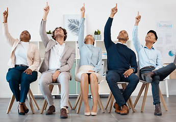 Image showing Business people, team and hands raised for asking question during workshop, training or meeting. Collaboration, teamwork and goal with crowd pointing up to volunteer, praise or show advertising idea