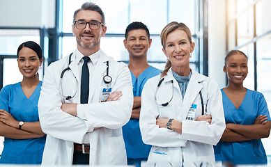 Image showing Doctors, nurses and team portrait in hospital, clinic or medical office. Teamwork, diversity and healthcare professionals standing together with arms crossed in confidence, collaboration or support.