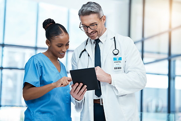 Image showing Teamwork, tablet and healthcare with a doctor and nurse working together as a team in the hospital. Collaboration, internet and medical with a man and woman surgeon at work on an online diagnosis