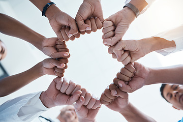 Image showing Corporate diversity, teamwork and fist in circle of group of business employees at office team building motivation event. Staff collaboration, professional community and fist bump to support mission