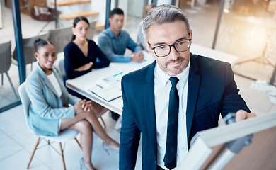 Image showing Presentation, meeting and business people for finance strategy, marketing coaching or company innovation brainstorming idea. Manager writing on whiteboard in a staff team building company workshop