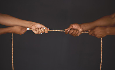 Image showing Tug of war, man and woman pulling rope in opposite direction for opposition, power and inequality in business. Competition and challenge with people hands in battle, struggle and fight for leadership