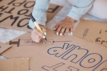 Image showing Covid, poster and protest sign woman prepare, create and use carboard for vaccine, corona safety and protection. Female, write and demonstrators against vaccinations, make placard and slogan.