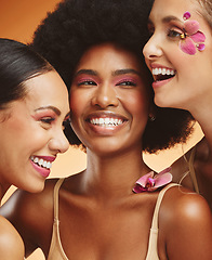 Image showing Women, beauty and flowers, makeup and diversity of models on orange studio background. Skincare, face and happy, young and elegant female group posing together with cosmetics, orchids or pink plants.