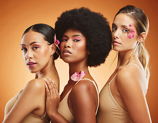 Image showing Diversity, skincare and beauty with model woman friends on a brown background in studio for makeup or wellness. Portrait, empowerment and natural with a female group posing together for inclusion