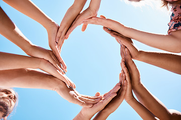 Image showing Hands, circle and community support hand sign of people and friends outdoor with a blue sky. Happy, trust and hope of women and men together with diversity to show love, care and happiness