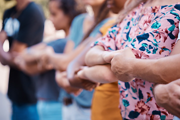 Image showing Hands, solidarity and protest with a group of people standing in unity at a rally or demonstration. Community, human rights and teamwork with a movement ready to fight for freedom or stop a crisis