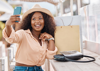 Image showing Selfie, shopping bags and woman with phone, happy in hat at city cafe. At the mall, girl with smile and smartphone on 5g video call after discount sale at luxury fashion retail shop on summer holiday