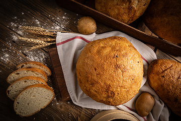 Image showing Artisan whole and sliced sourdough bread