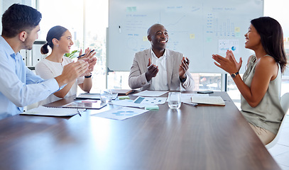 Image showing Business people, meeting and clapping in boardroom for success, achievement or team promotion at the office. Black man executive in conference explaining teamwork in celebration for reaching goals