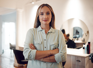 Image showing Entrepreneur, woman and small business owner at hairdresser, beauty parlor or salon with confidence, pride and motivation for work or service. Portrait of female hair stylist with arms folded at work