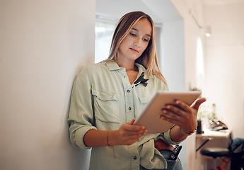 Image showing Woman, small business and research on tablet for startup company browsing internet in remote work at salon. Professional freelancer female on touchscreen for online marketing or social media at home