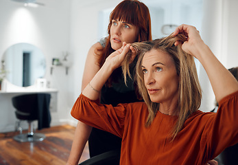 Image showing Women in hair salon, hairdresser client thinking of change and professional beauty care for roots. Color dye treatment, blonde customer decision and conversation about elegant womans haircut quality