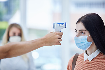 Image showing Travel, thermometer and covid scanning in airport with a woman and security, compliance and safety check. Health, corona and worker checking lady digital results before traveling border control