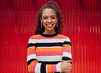 Image showing Fashion, smile and woman against a red background in the city during a holiday in Amsterdam. Portrait of a happy, African and cool girl on a travel vacation for freedom, adventure and happiness