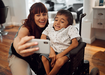 Image showing Child, cerebral palsy and happy phone selfie of a mobile disability boy in a wheelchair. Woman or mother smile with a young kid using technology to take a picture together with happiness and care