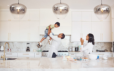 Image showing Mother, father and child baking or cooking as a happy family in a house kitchen with mom and dad having fun with boy. Love, learning and parents teaching young son development skills and to bake cake