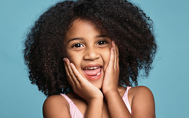 Image showing .Happy girl, child and excited surprise face of a kid in a studio with happiness and wow expression. Portrait of a young model from Chicago with natural hair showing a smile, omg and shock pose.