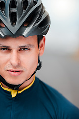 Image showing Sports man, cycling and face of cyclist looking ready, cool and determined while training outdoors. Mindset, motivation and portrait of athlete biking outside, proud, serious and fitness goal