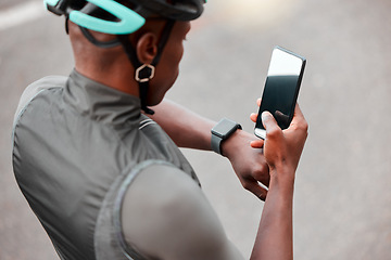 Image showing Cycling, smartwatch and phone by man cyclist tracking cardio, pulse and health on an online app in a road. Sports, fitness and watch with black man cycling and monitoring progress, heart and wellness