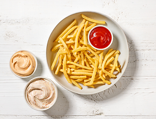 Image showing french fries and dip sauces