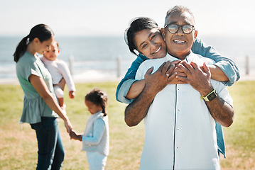 Image showing Family, love and portrait of grandparents in park for summer, health and retirement together. Happy, lifestyle and bonding with children and old couple for smile, hug and bonding in outdoors
