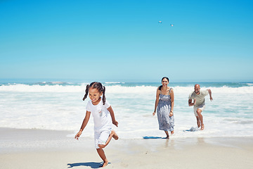 Image showing Summer, travel and family running at beach for vacation, freedom and happy together. Holiday, fun and wellness with parents playing with girl in ocean water for health, energy and youth lifestyle