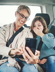Image showing Phone, surprise and mother with child on car journey, travel or road trip for adventure, bond or fun quality time together. Love, shock or transport for kid girl with happy mom streaming online movie
