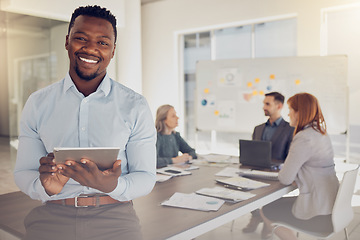 Image showing Leadership, tablet and meeting with a black man CEO or manager sitting on a boardroom table with his team in the office. Technology, planning and strategy with a business leader ready for training