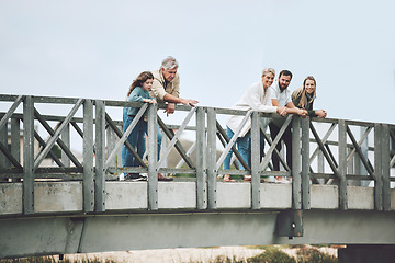 Image showing Big family, bridge and happy travel, vacation or holiday trip together outdoors. Family, generations and mom, dad and girl, grandma and grandpa spending time together, love and bonding in Canada.