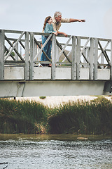 Image showing Family, lake bridge and grandfather with child bond, enjoy nature vacation or holiday quality time together. Love, senior man and kid girl at Canada countryside for peace, freedom or river adventure