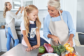 Image showing Learning, mother and grandmother cooking with girl teaching her a family recipe, vegetables and food diet. Smile, mom and senior woman love helping kid in the kitchen with child development at home