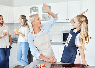 Image showing High five, kitchen and cooking family or grandmother and child for success, learning achievement or home food health goal. Celebrate sign with senior woman and girl kid for support or help with lunch
