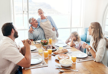 Image showing Breakfast, communication and big family eating food together at the dining room table of their house. Senior man and woman speaking about funny story during lunch with children in their home